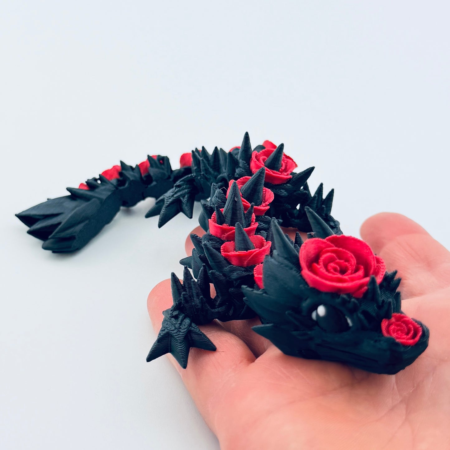 3d printed baby rose dragon - black and red - view 8
