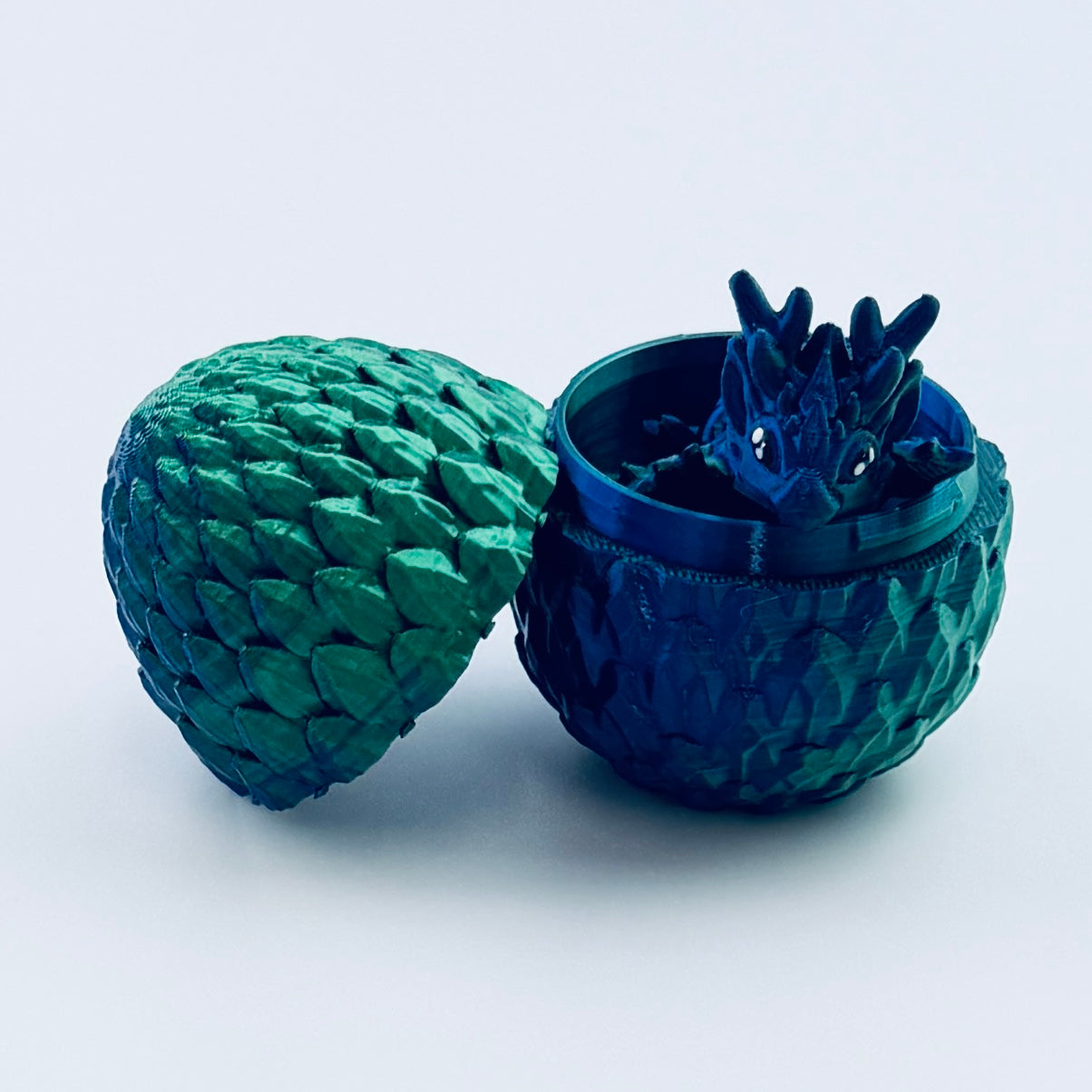 teeny tiny dragon inside egg - blue/green