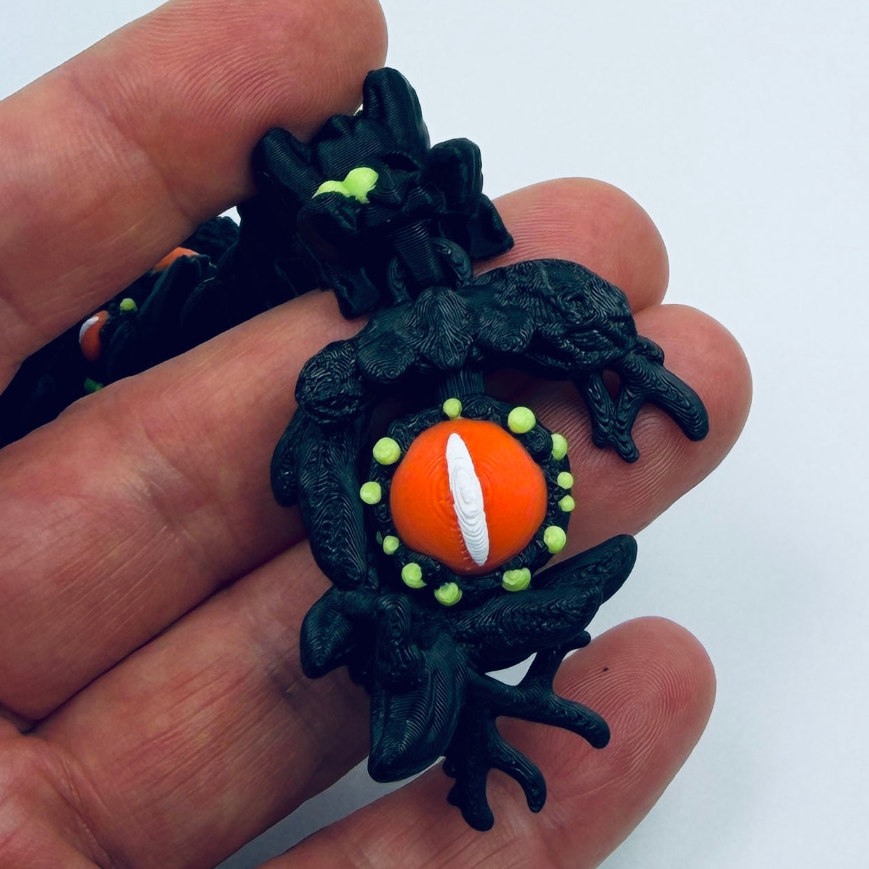 Baby Infested Dragon - closeup of spinning eyeball tail