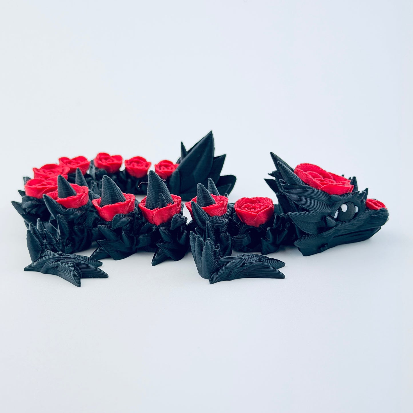 3d printed baby rose dragon - black and red - view 6