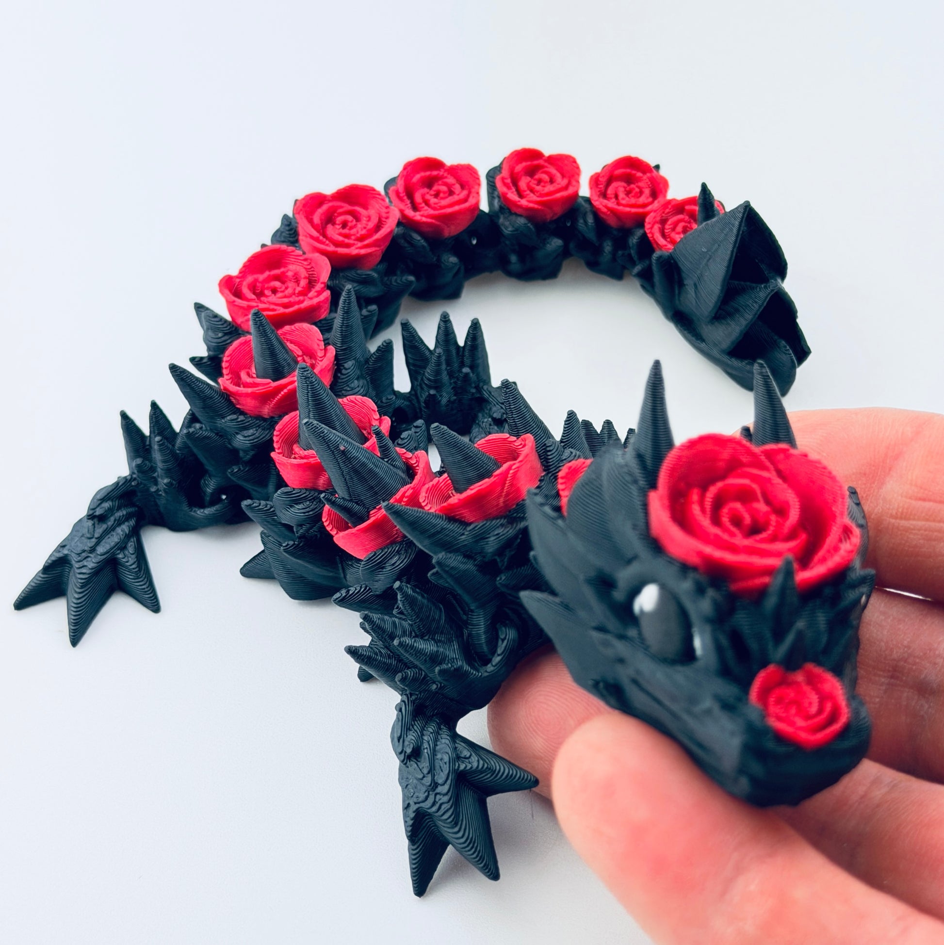 3d printed baby rose dragon - black and red - view 1