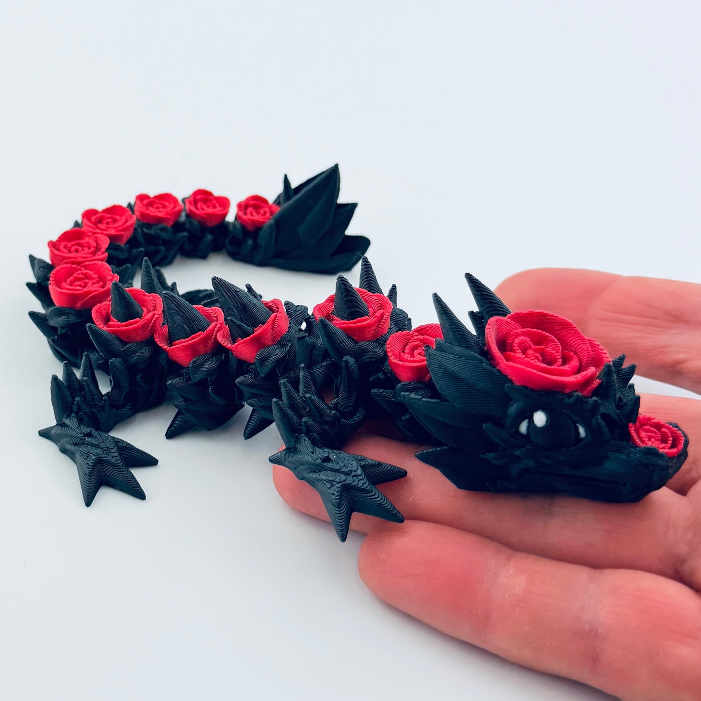 3d printed baby rose dragon - black and red - view 2
