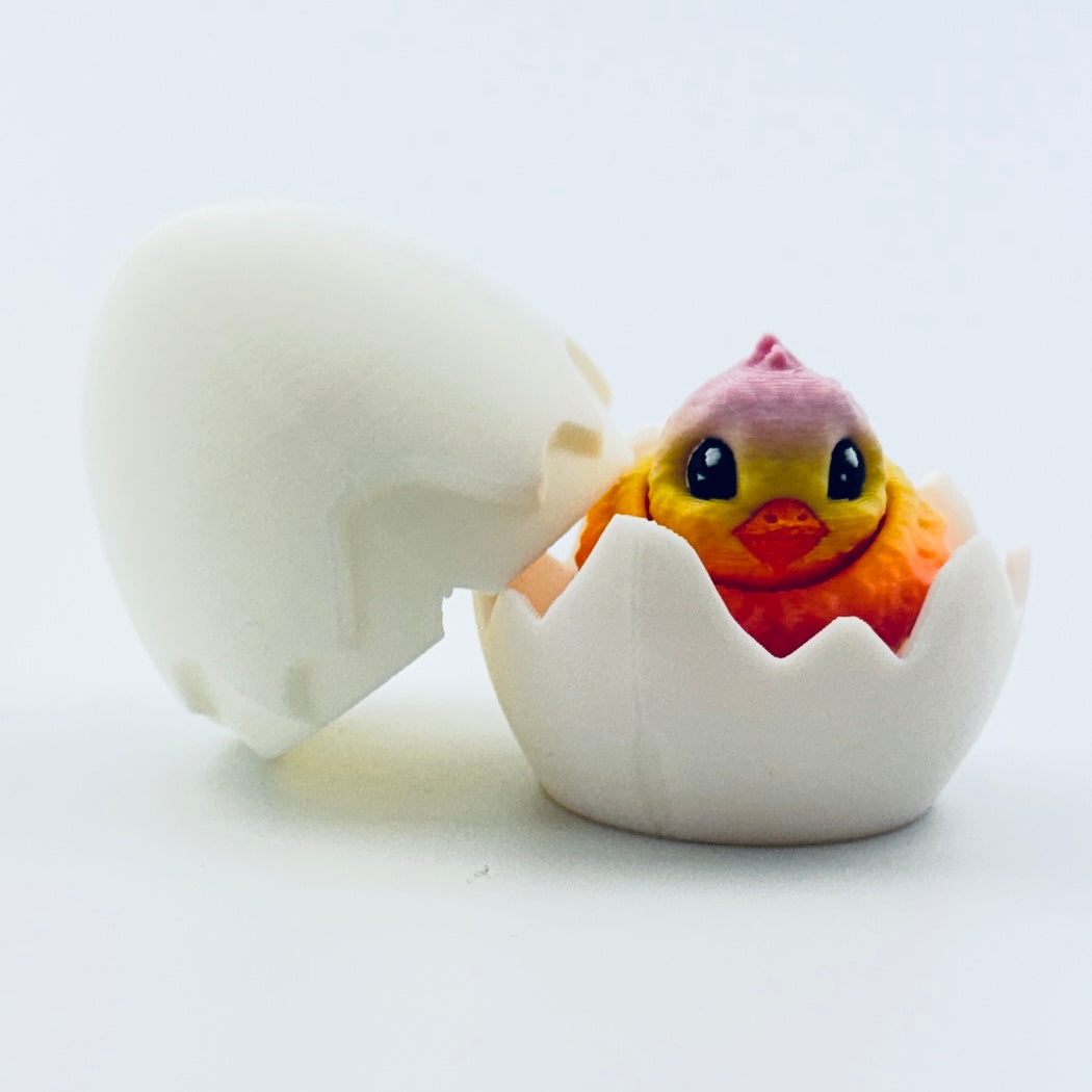 3d printed chick inside white egg